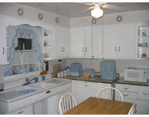 1328 Oakridge Road McDonald, PA 15057 - Photo 6 of 8 Kitchen. Bright kitchen, has room for table. Appliances included in sale. Ceiling fan. Door leads outside to the beautiful back yard.