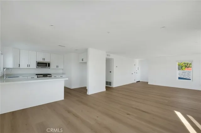 a kitchen with stainless steel appliances a stove and a refrigerator