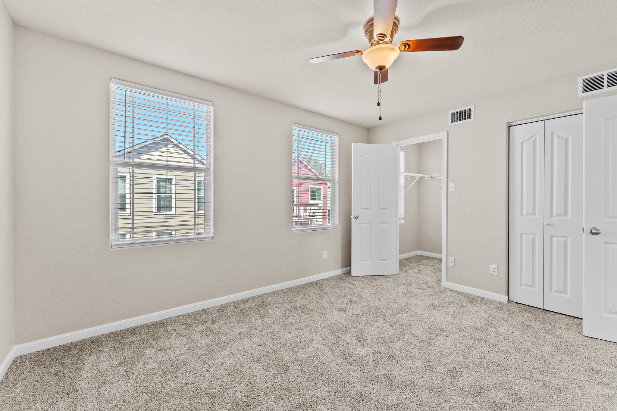 220 Trestle Tree San Marcos, TX 78666 - Photo 14 of 28 Unfurnished bedroom with a closet, light colored carpet, and a ceiling fan
