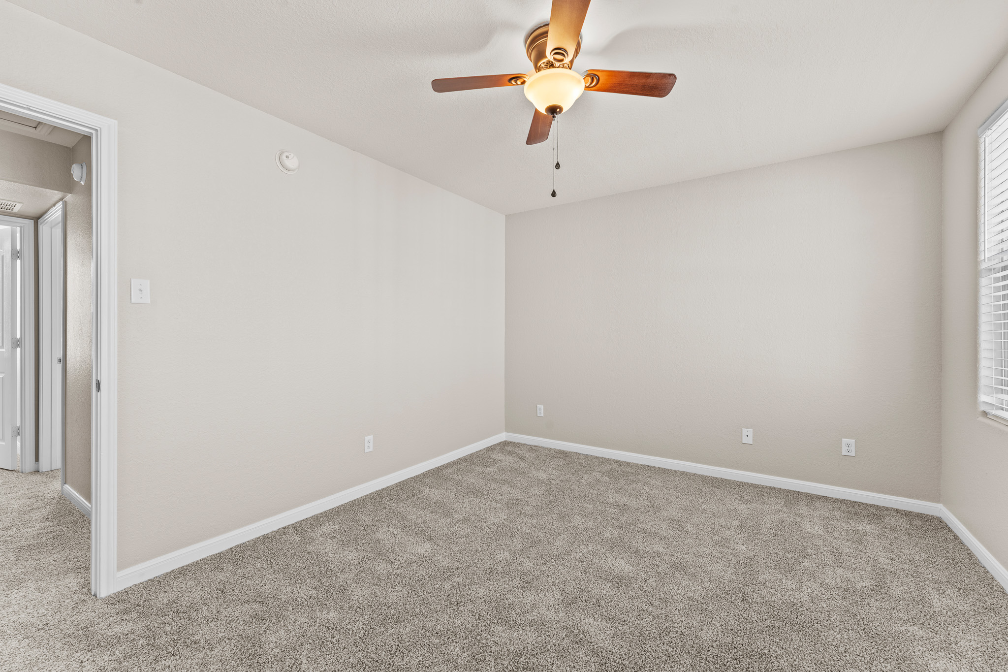 220 Trestle Tree San Marcos, TX 78666 - Photo 16 of 28 Carpeted empty room with baseboards and a ceiling fan