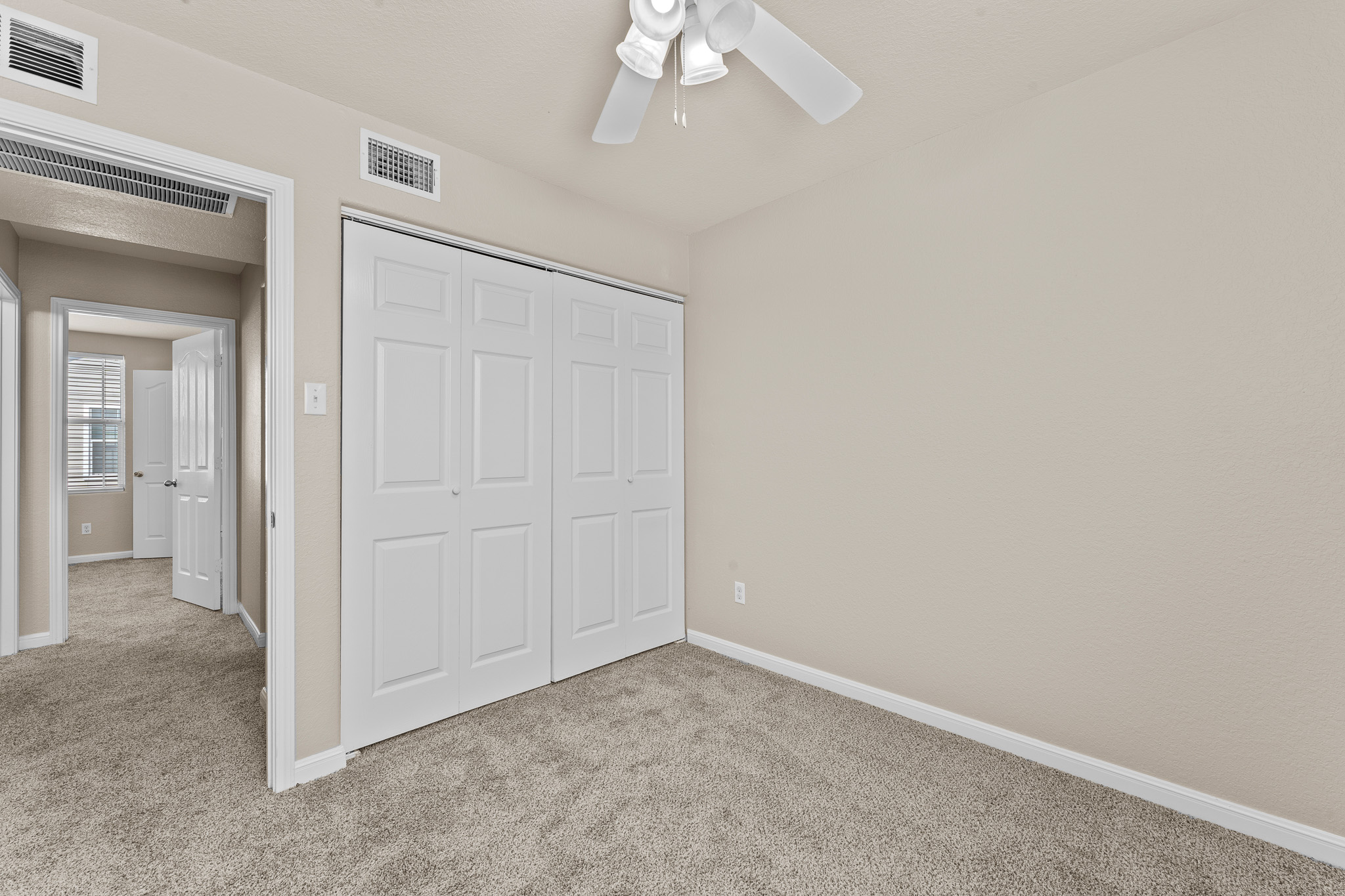 220 Trestle Tree San Marcos, TX 78666 - Photo 20 of 28 Unfurnished bedroom featuring carpet floors, a closet, and ceiling fan