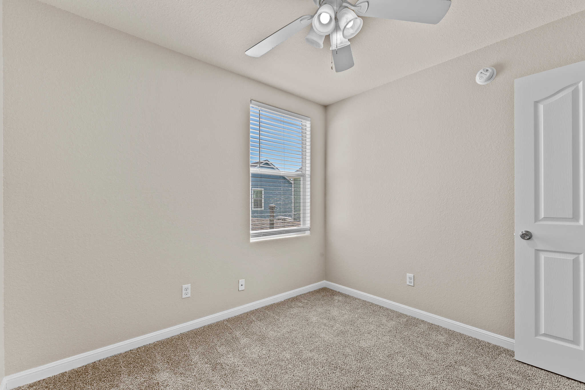 220 Trestle Tree San Marcos, TX 78666 - Photo 21 of 28 Unfurnished room featuring light colored carpet and ceiling fan