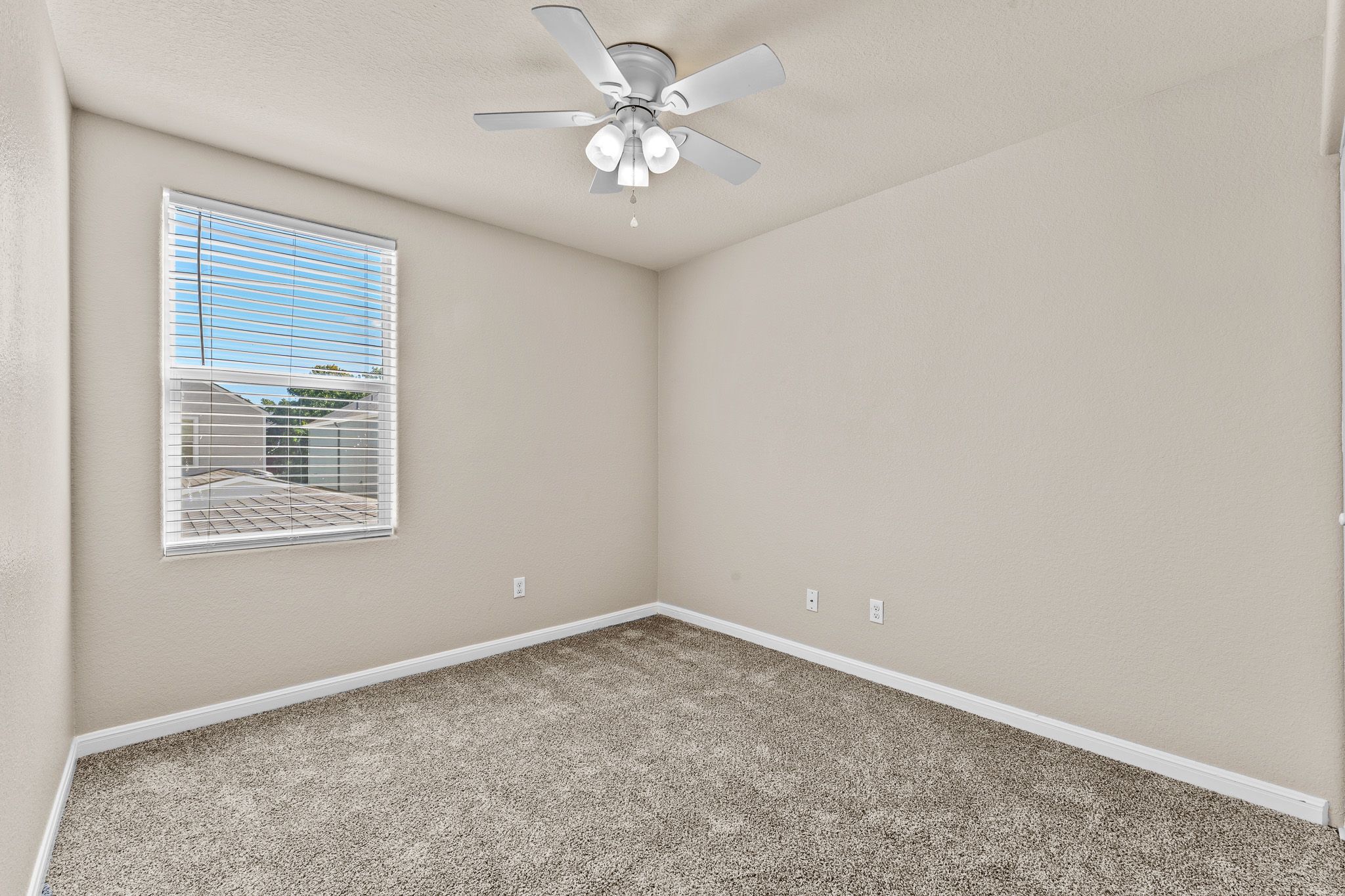 220 Trestle Tree San Marcos, TX 78666 - Photo 22 of 28 Carpeted spare room with baseboards and a ceiling fan