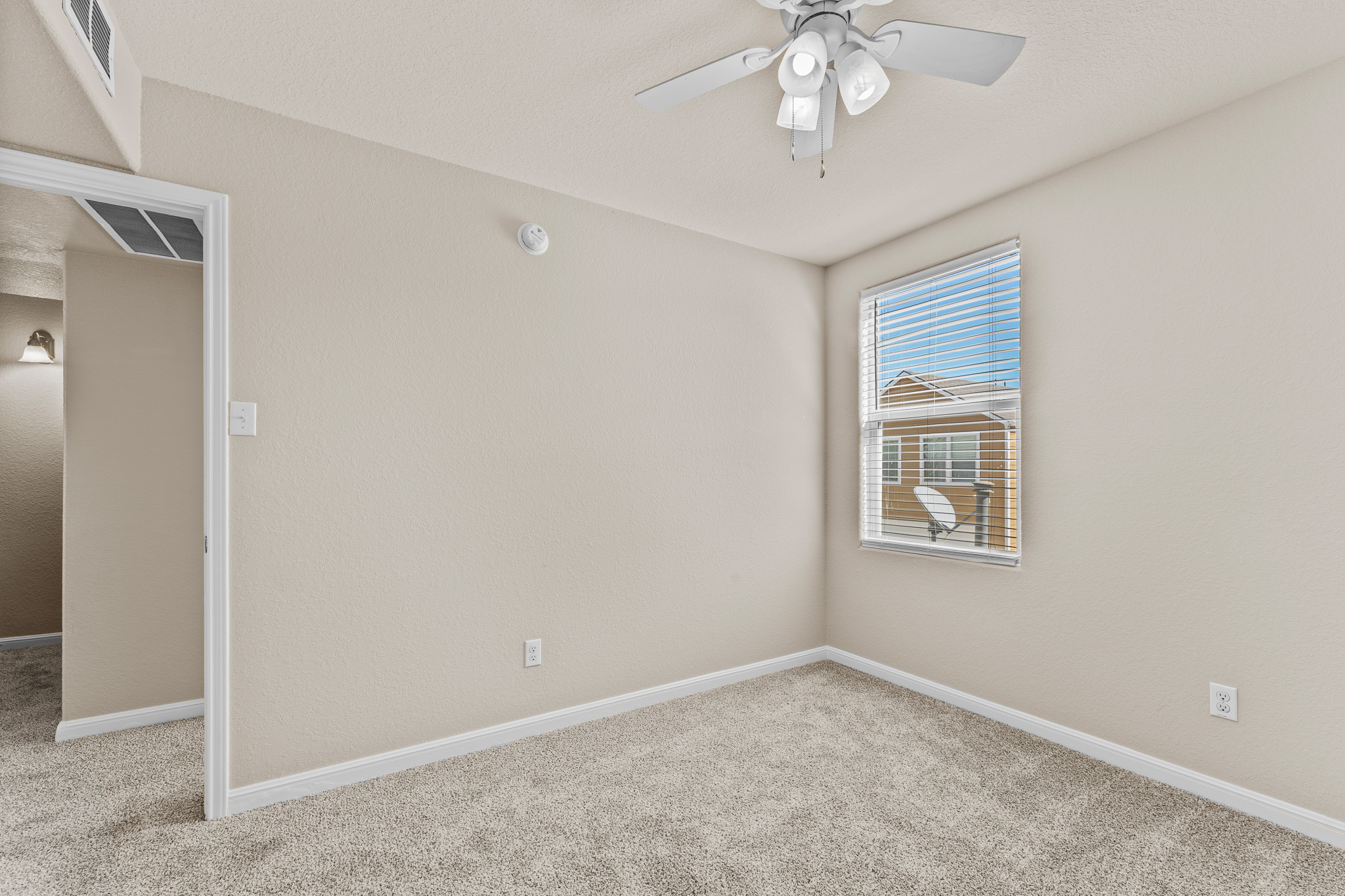 220 Trestle Tree San Marcos, TX 78666 - Photo 23 of 28 Empty room featuring light colored carpet and ceiling fan