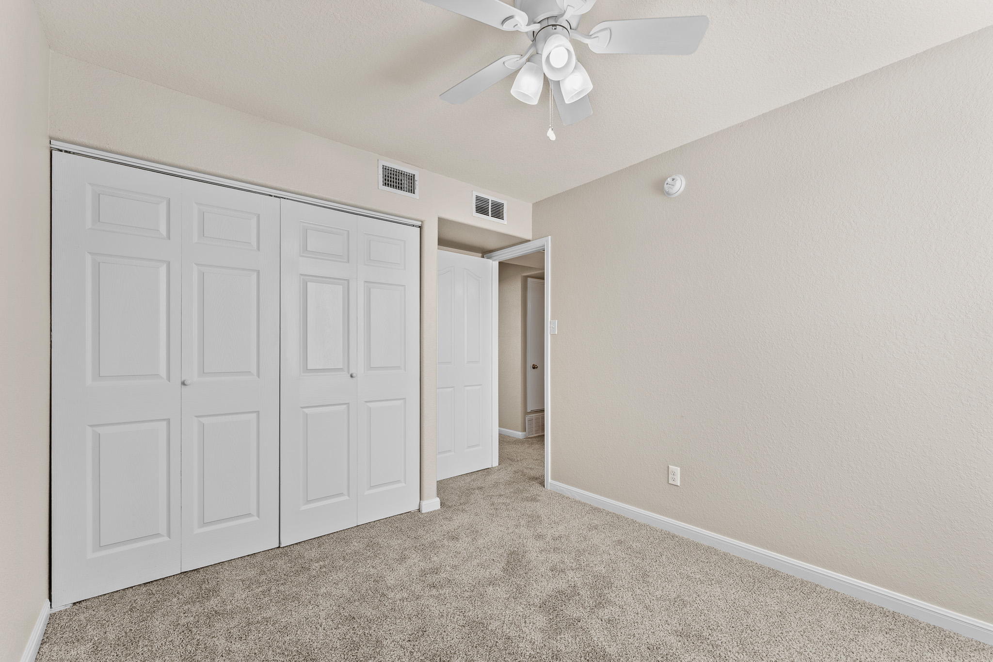 220 Trestle Tree San Marcos, TX 78666 - Photo 24 of 28 Unfurnished bedroom featuring carpet, ceiling fan, and a closet