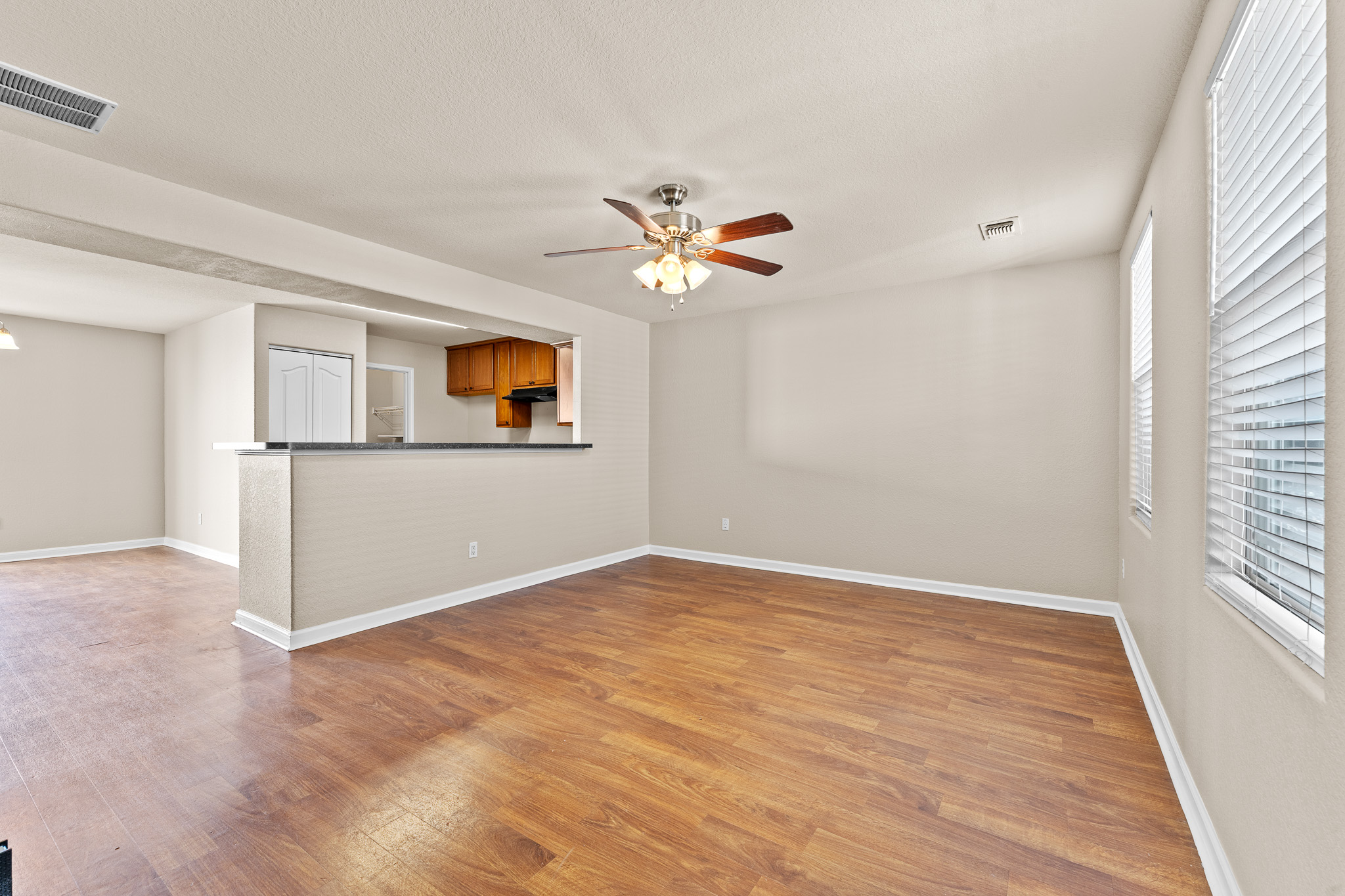220 Trestle Tree San Marcos, TX 78666 - Photo 4 of 28 Unfurnished living room featuring light wood-type flooring and ceiling fan