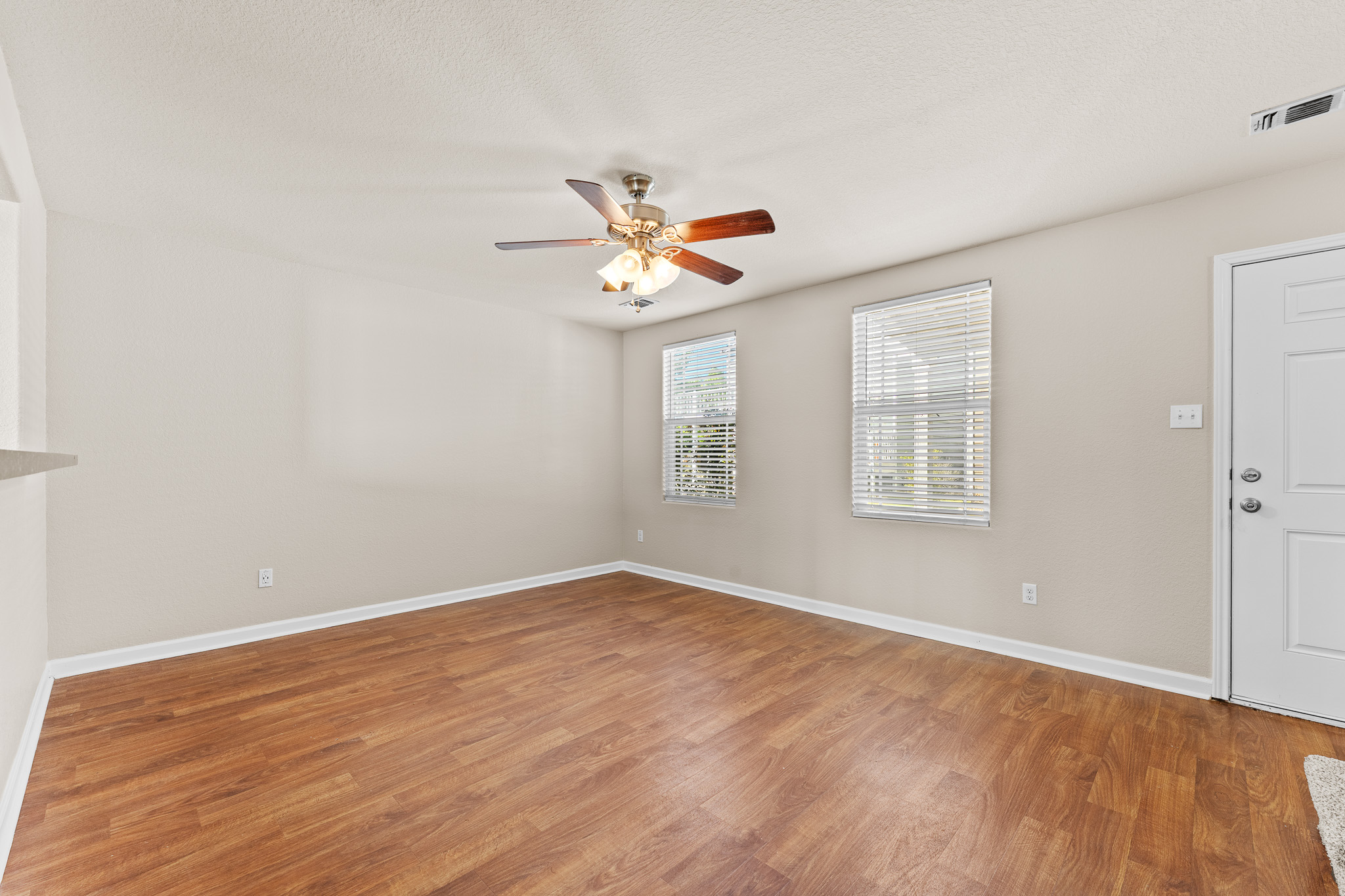 220 Trestle Tree San Marcos, TX 78666 - Photo 7 of 28 Spare room with light wood-style floors and ceiling fan