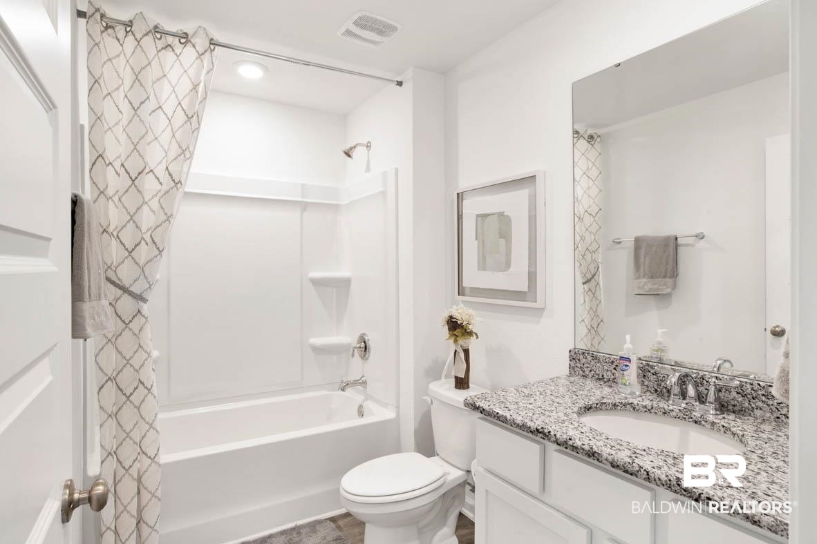 17075 REFLECTION Street Loxley, AL 36551 - Photo 10 of 11 Full bathroom with oversized vanity, toilet, and shower / bath combo