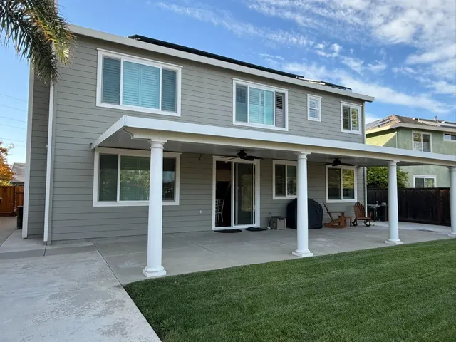 front view of a house with a yard