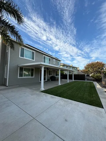 front view of a house with a yard