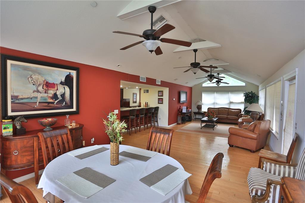 500 Southeast 69th Place Ocala, FL 34480 - Photo 13 of 46 a living room with furniture and a chandelier