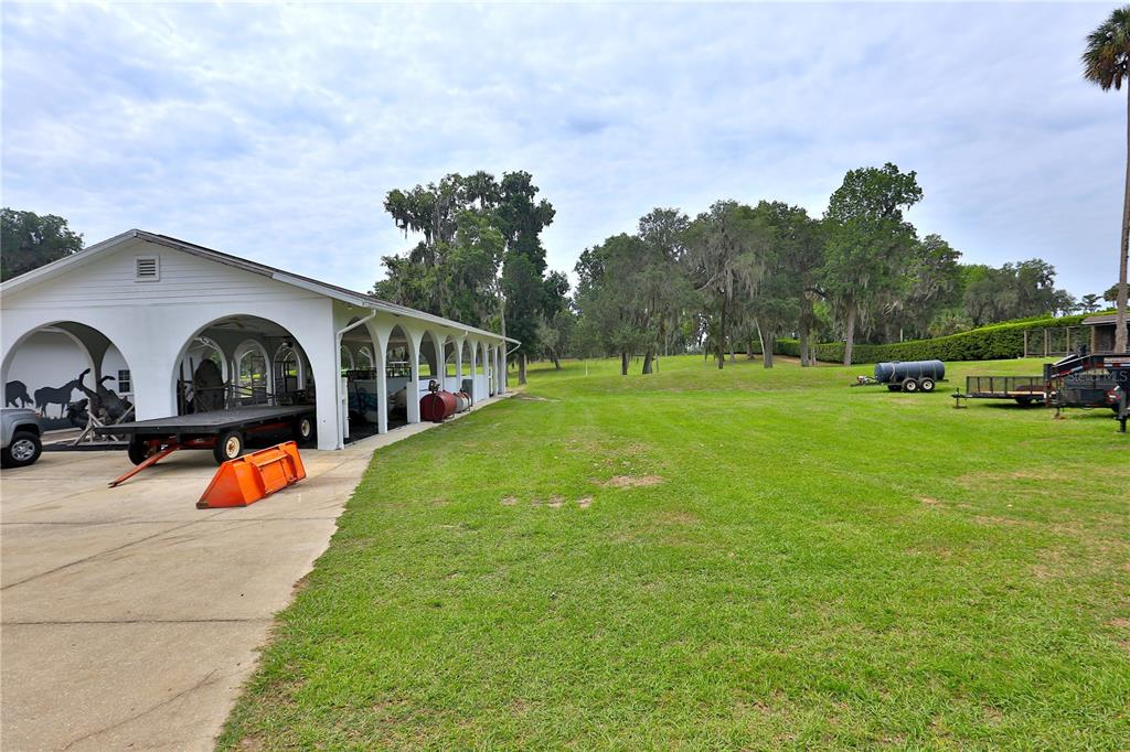 500 Southeast 69th Place Ocala, FL 34480 - Photo 17 of 46 an outdoor view of the garden with plants and trees