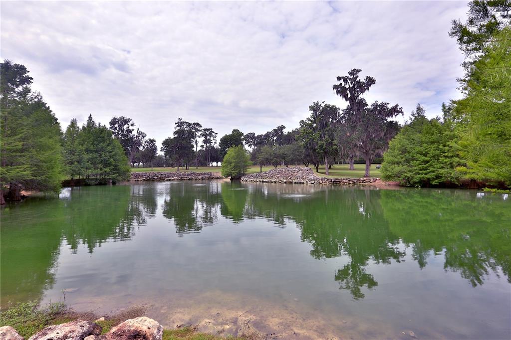 500 Southeast 69th Place Ocala, FL 34480 - Photo 18 of 46 a view of a lake with houses in the back