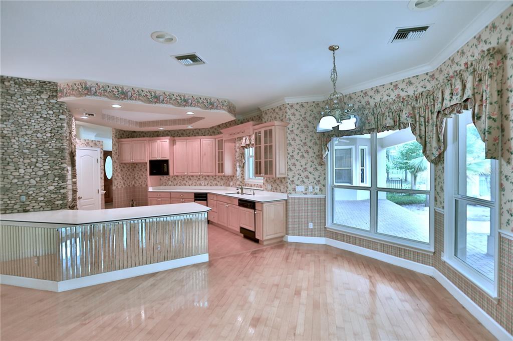 500 Southeast 69th Place Ocala, FL 34480 - Photo 25 of 46 a view of a kitchen with a sink and microwave