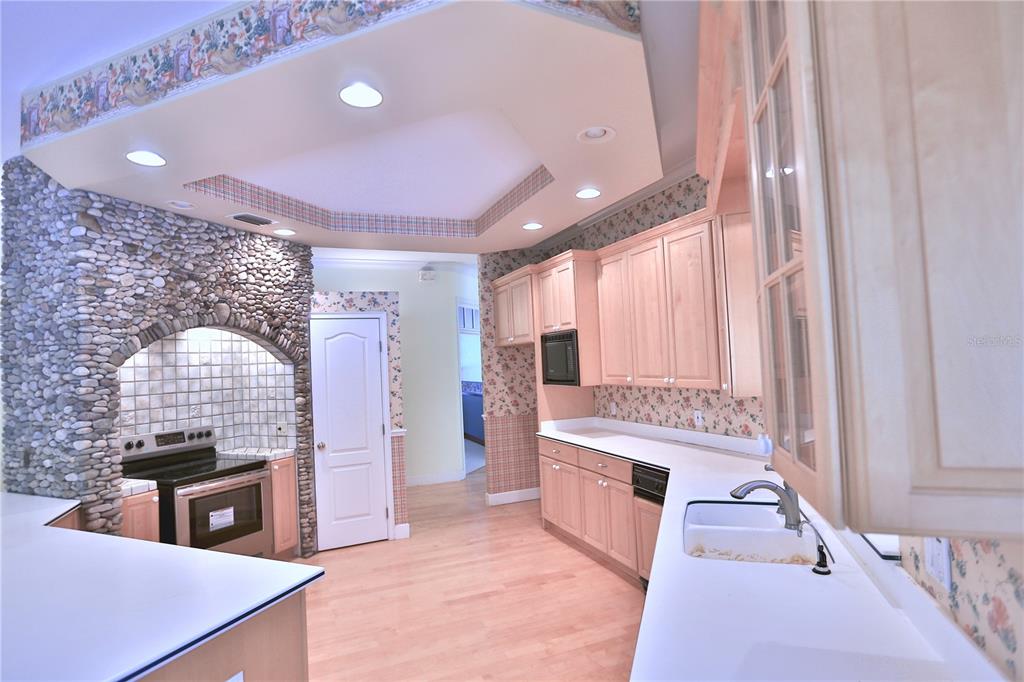 500 Southeast 69th Place Ocala, FL 34480 - Photo 29 of 46 a kitchen with a stove and a refrigerator