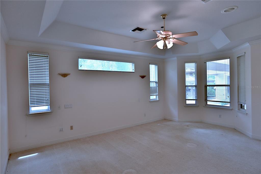 500 Southeast 69th Place Ocala, FL 34480 - Photo 32 of 46 wooden floor in an empty room with a window