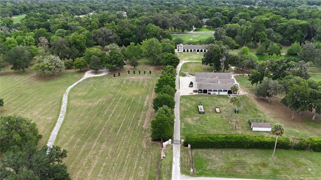 500 Southeast 69th Place Ocala, FL 34480 - Photo 43 of 46 an aerial view of residential houses with outdoor space and swimming pool