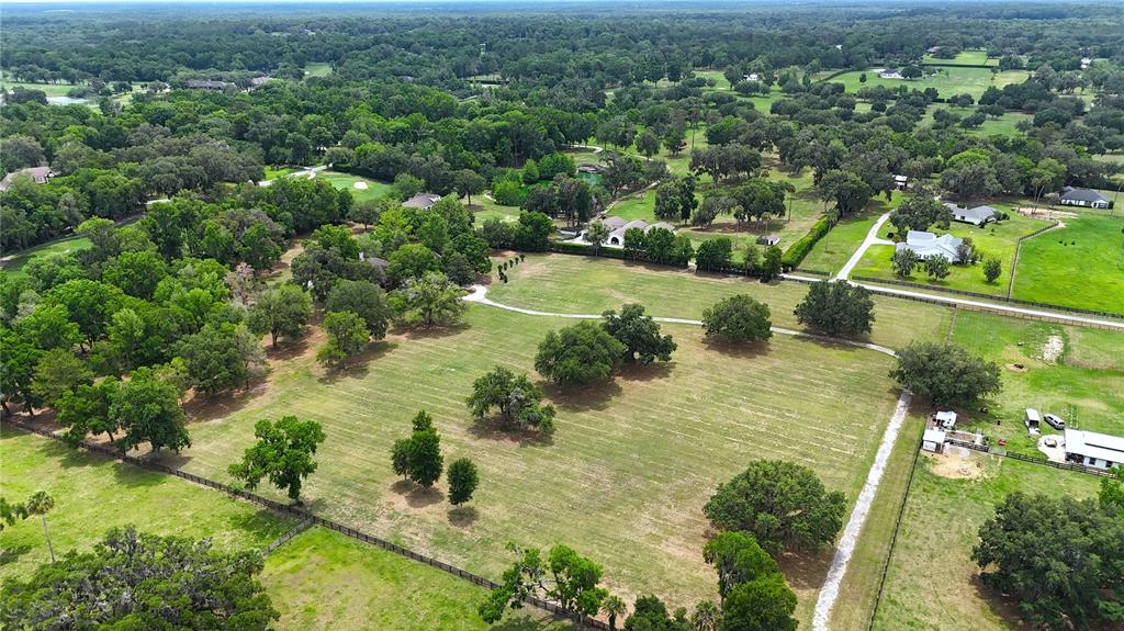 500 Southeast 69th Place Ocala, FL 34480 - Photo 45 of 46 an aerial view of residential houses with outdoor space and trees