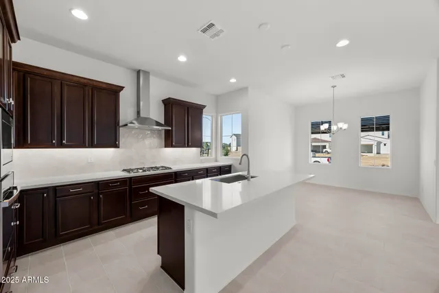 a view of a living room and kitchen with a large window