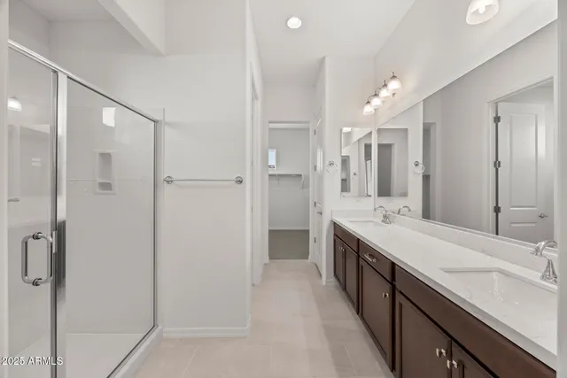 a bathroom with a glass shower door