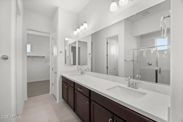 a bathroom with a sink vanity and a mirror