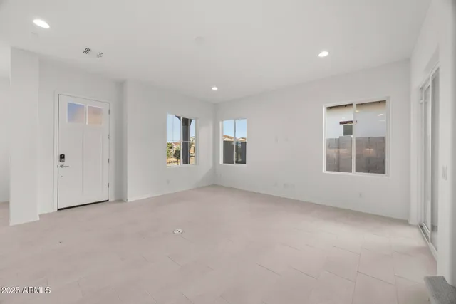 a large kitchen with kitchen island granite countertop a large counter top stainless steel appliances and cabinets