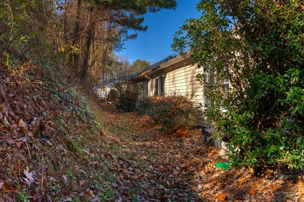 a view of a house with a tree