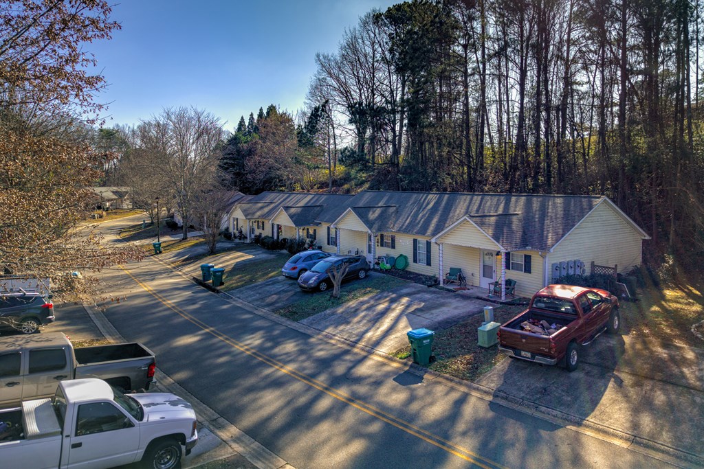 172 Jacobs Way Jasper, GA 30143 - Photo 10 of 13 a view of a patio with table and chairs with wooden floor and fence