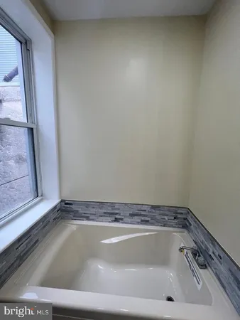 a view of a bathtub in a window