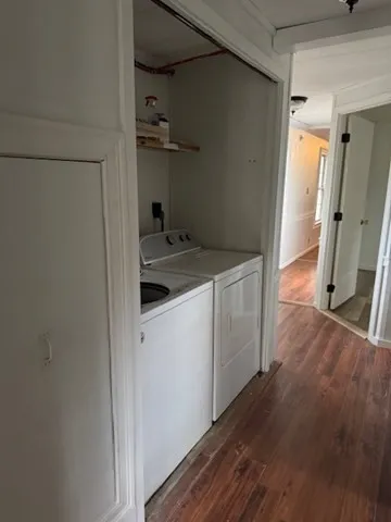 a view of a storage & utility room with wooden floor