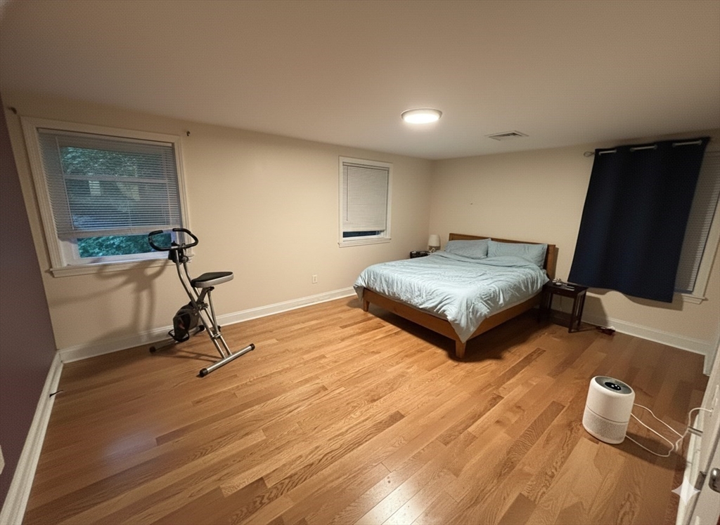 10 Riverbank Road, Unit 2 Maynard, MA 01754 - Photo 2 of 13 a living room with couch tv and a window