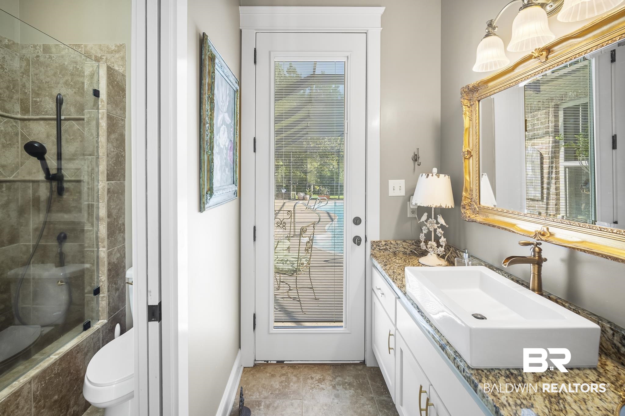 25212 Austin Road Daphne, AL 36526 - Photo 36 of 56 Bathroom with vanity, plenty of natural light, and tiled shower / bath combo