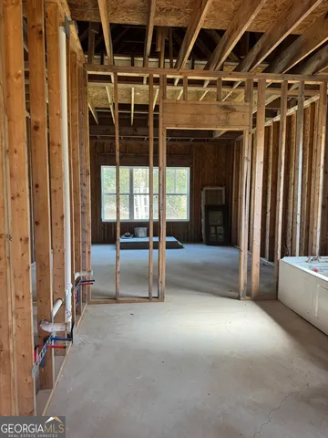 a view of porch with a table and chairs