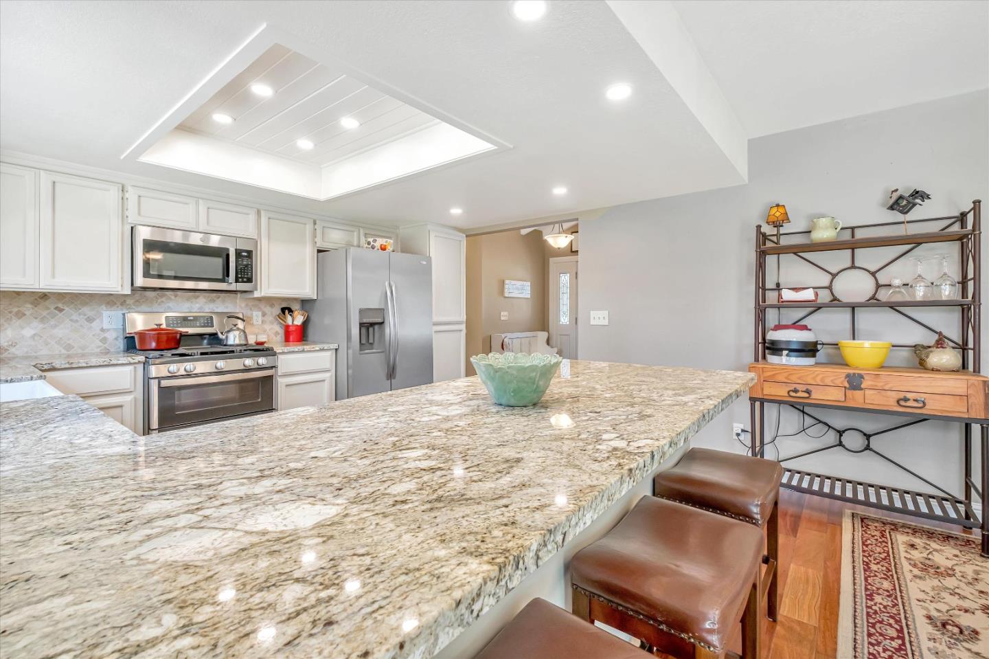 10 Linden Road Watsonville, CA 95076 - Photo 11 of 38 a kitchen with stainless steel appliances kitchen island granite countertop a sink and cabinets