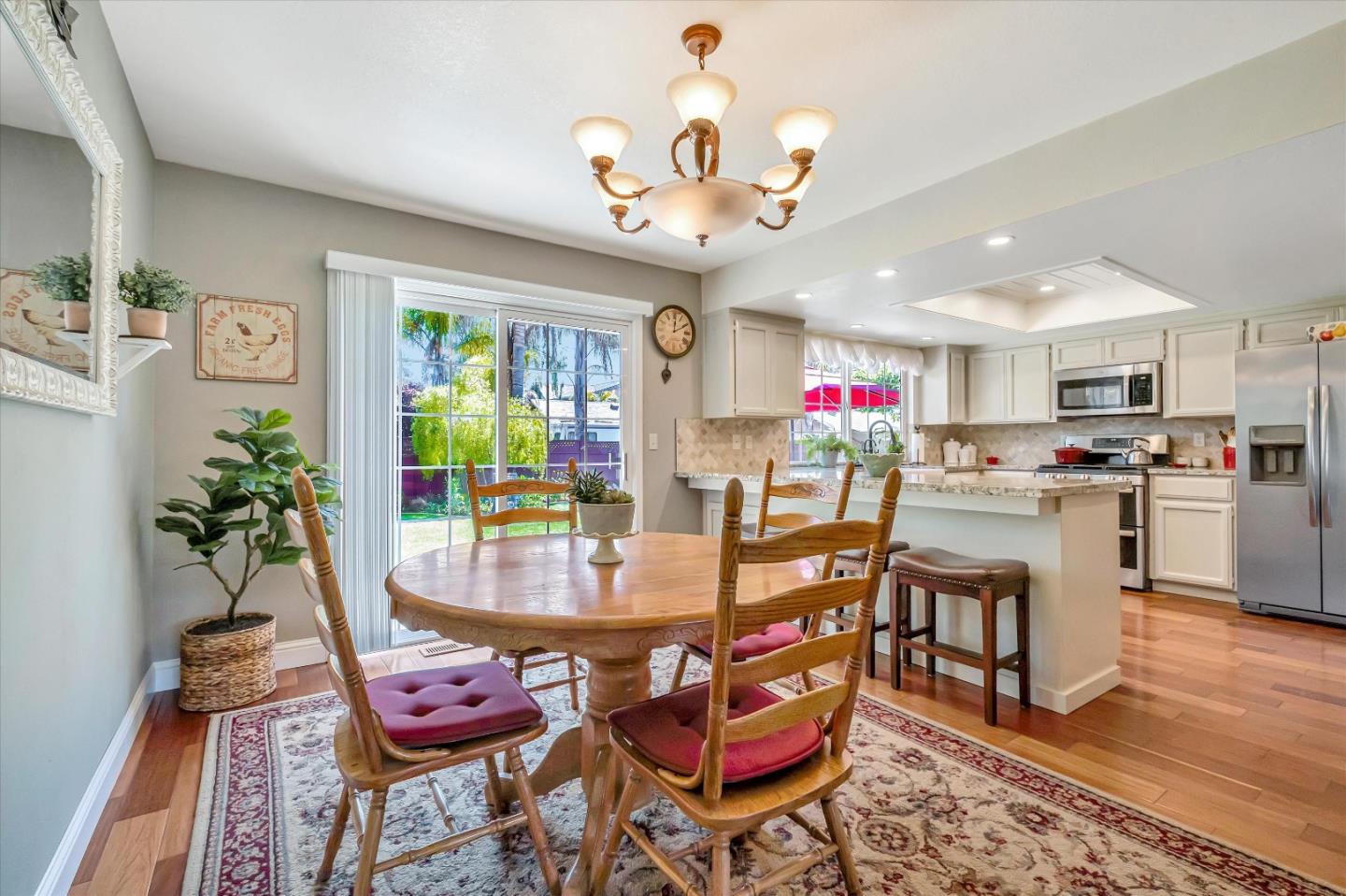10 Linden Road Watsonville, CA 95076 - Photo 13 of 38 a view of a dining room with furniture a rug and wooden floor