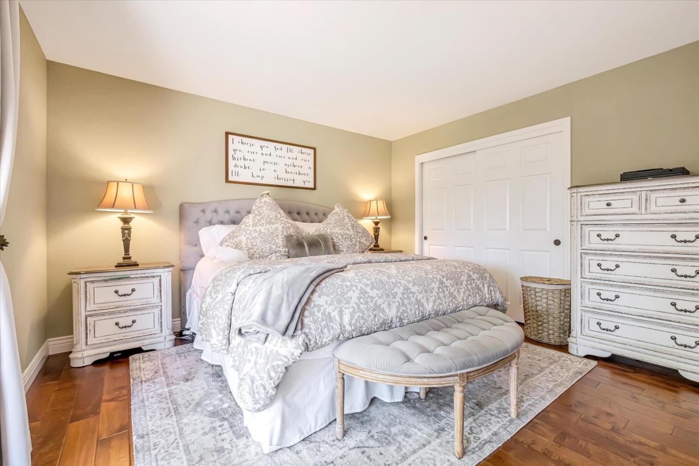10 Linden Road Watsonville, CA 95076 - Photo 18 of 38 a spacious bedroom with a bed a lamp and mirror