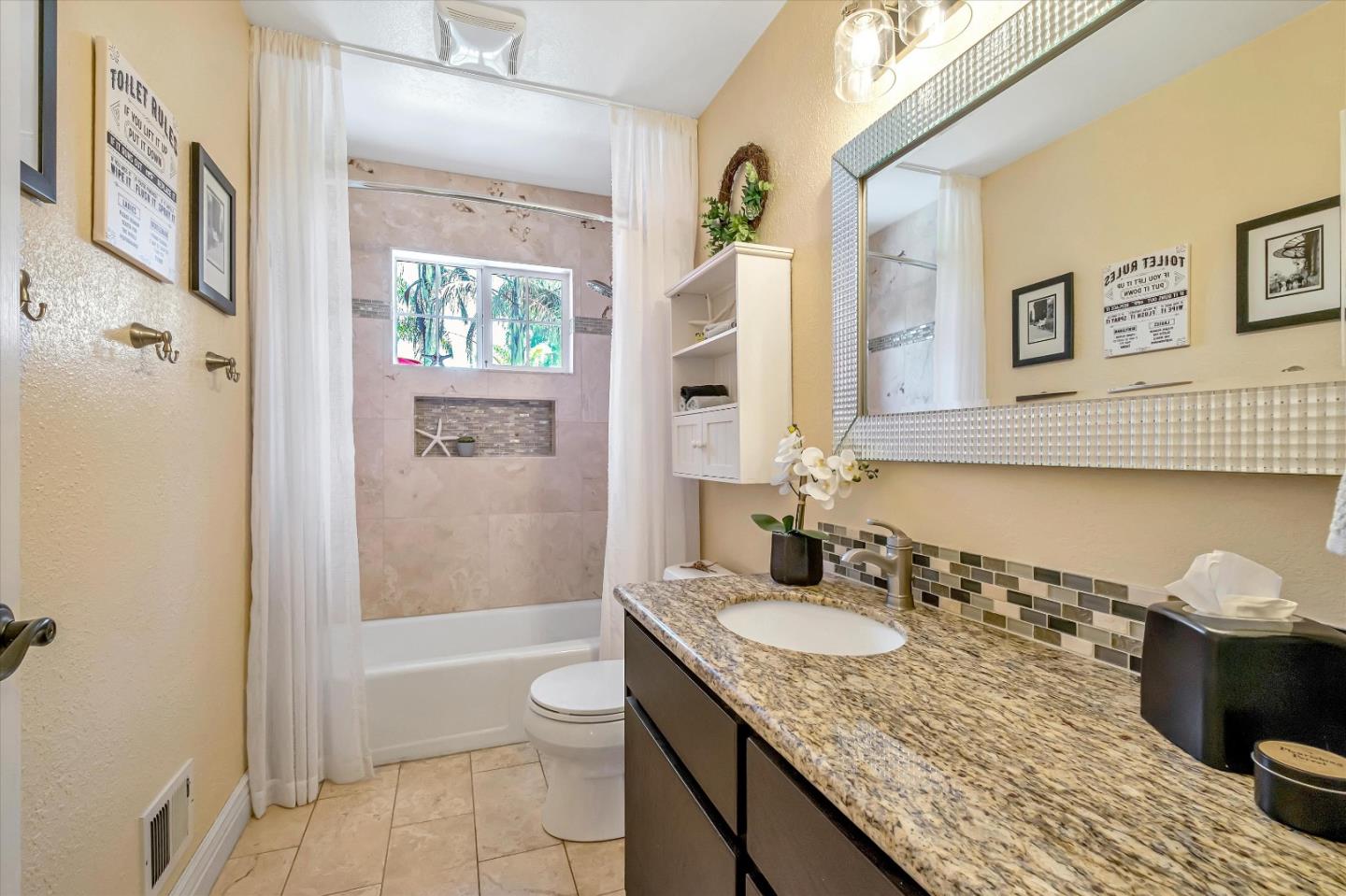 10 Linden Road Watsonville, CA 95076 - Photo 20 of 38 a bathroom with a granite countertop sink toilet and shower