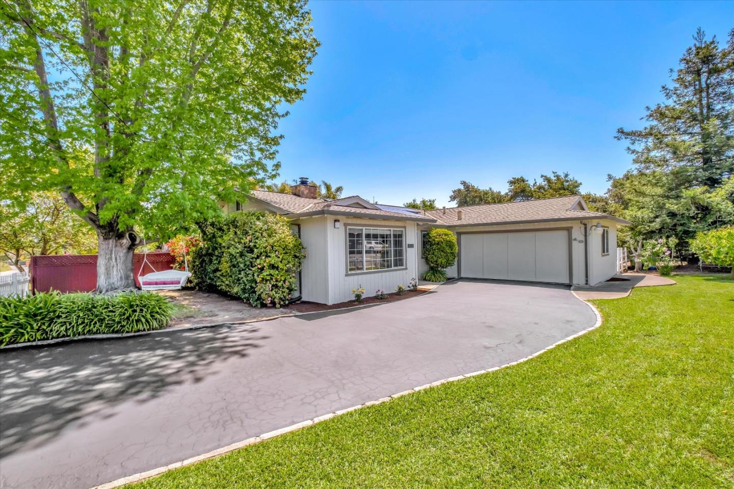 10 Linden Road Watsonville, CA 95076 - Photo 2 of 38 a front view of a house with a yard and a garage