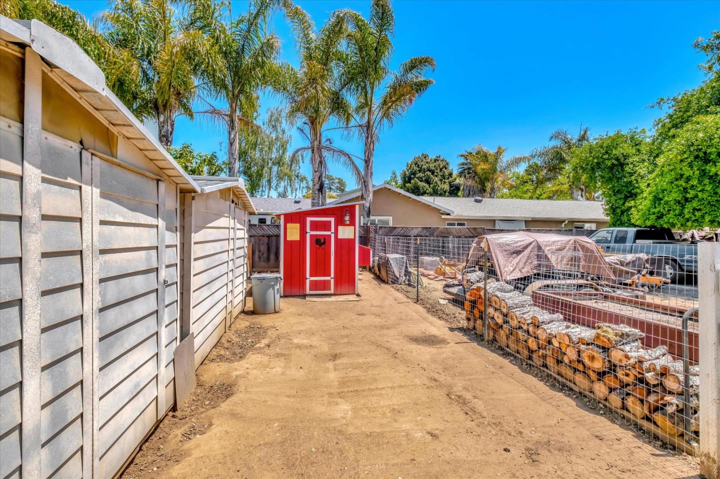10 Linden Road Watsonville, CA 95076 - Photo 33 of 38 a view of a backyard house with large trees and plants