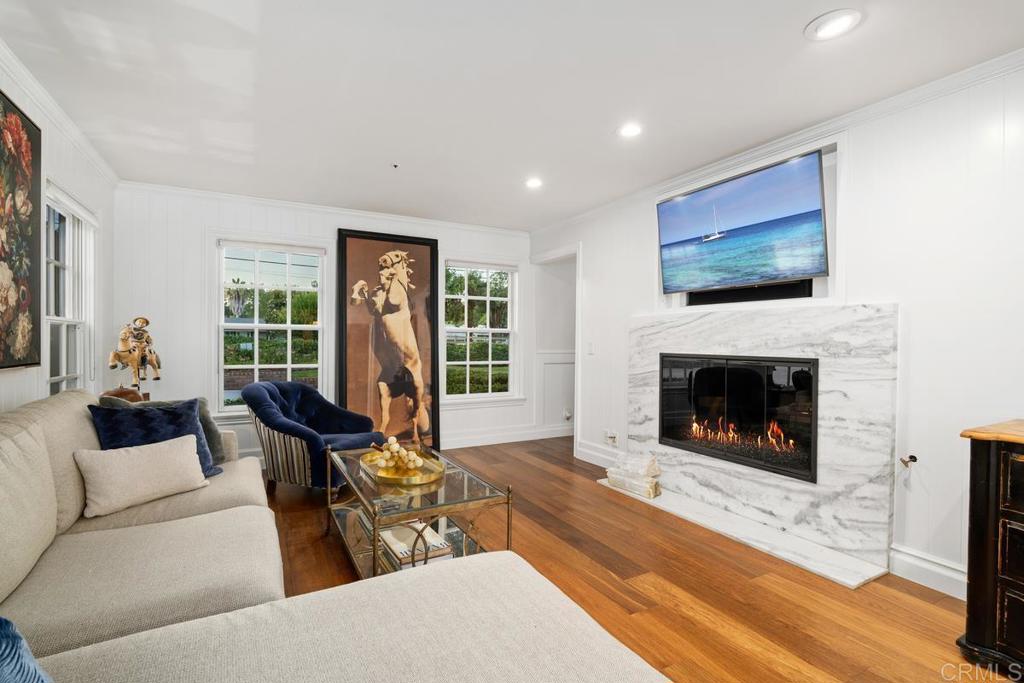 2539 Lone Jack Road Encinitas, CA 92024 - Photo 13 of 37 a living room with furniture a flat screen tv and a fireplace