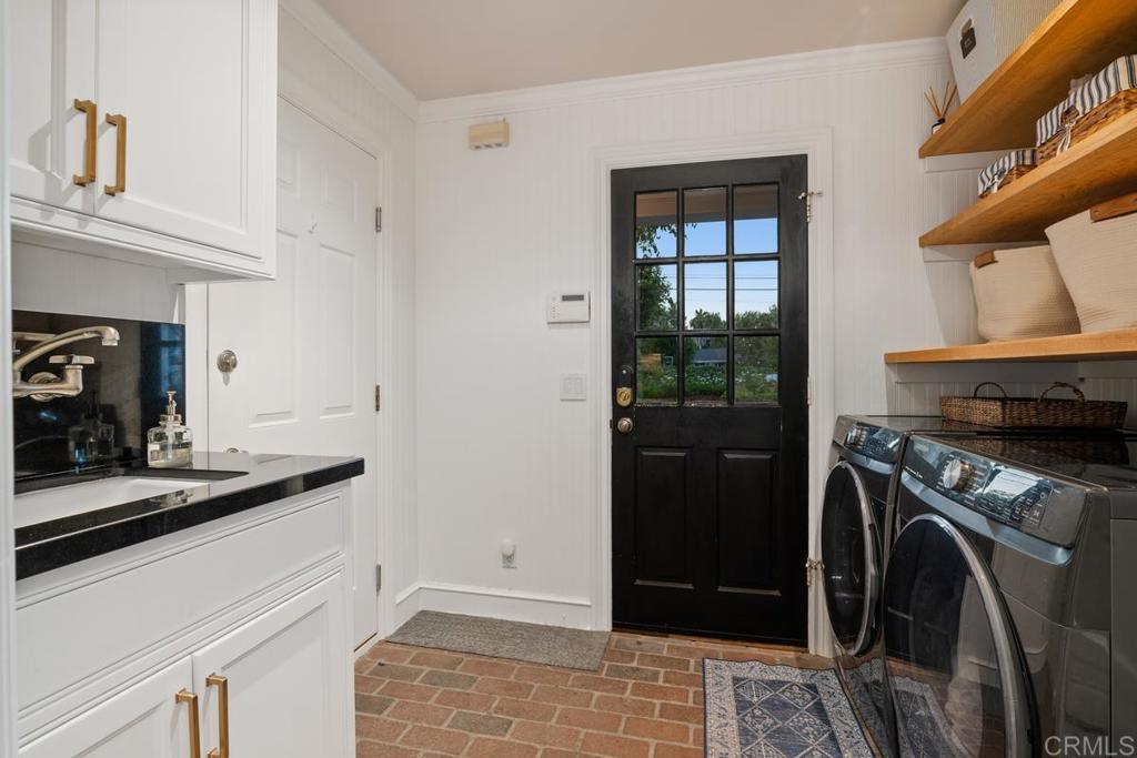 2539 Lone Jack Road Encinitas, CA 92024 - Photo 16 of 37 a view of a kitchen and utility room