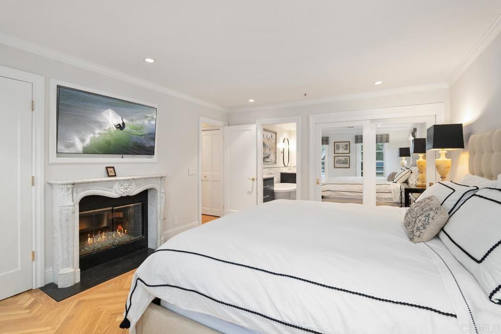 2539 Lone Jack Road Encinitas, CA 92024 - Photo 19 of 37 a bedroom with furniture and a flat screen tv