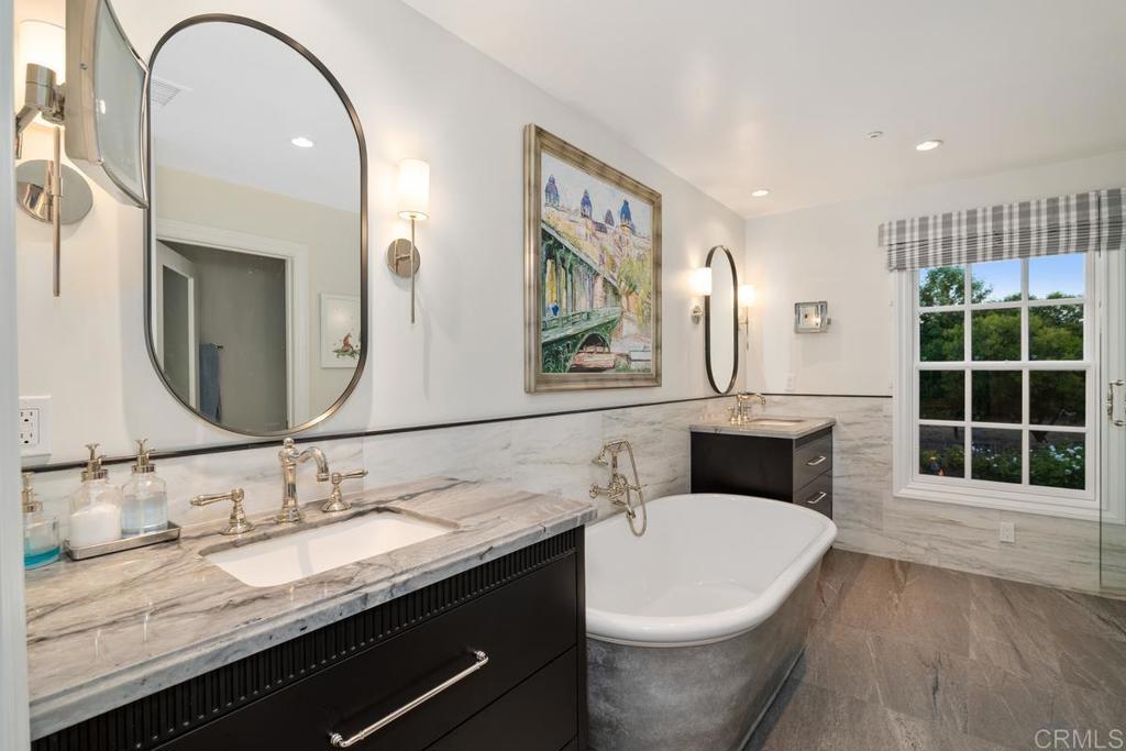 2539 Lone Jack Road Encinitas, CA 92024 - Photo 20 of 37 a bathroom with a double vanity sink and a mirror