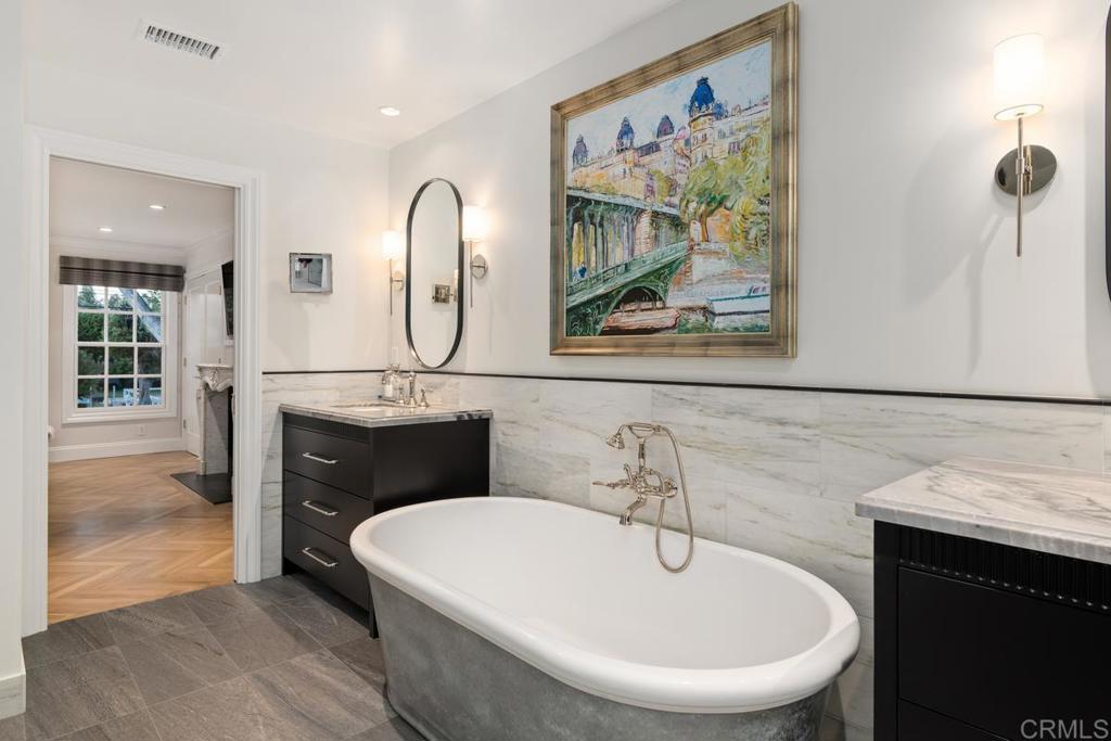 2539 Lone Jack Road Encinitas, CA 92024 - Photo 22 of 37 a bathroom with a sink and a mirror