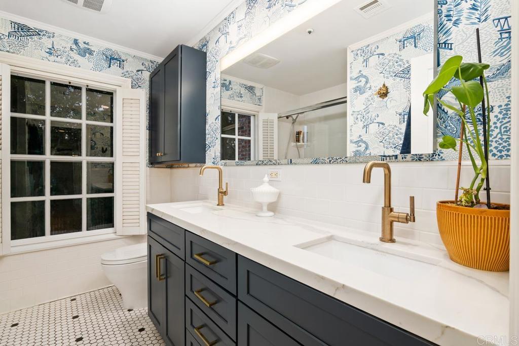 2539 Lone Jack Road Encinitas, CA 92024 - Photo 24 of 37 a bathroom with a sink a toilet and shower