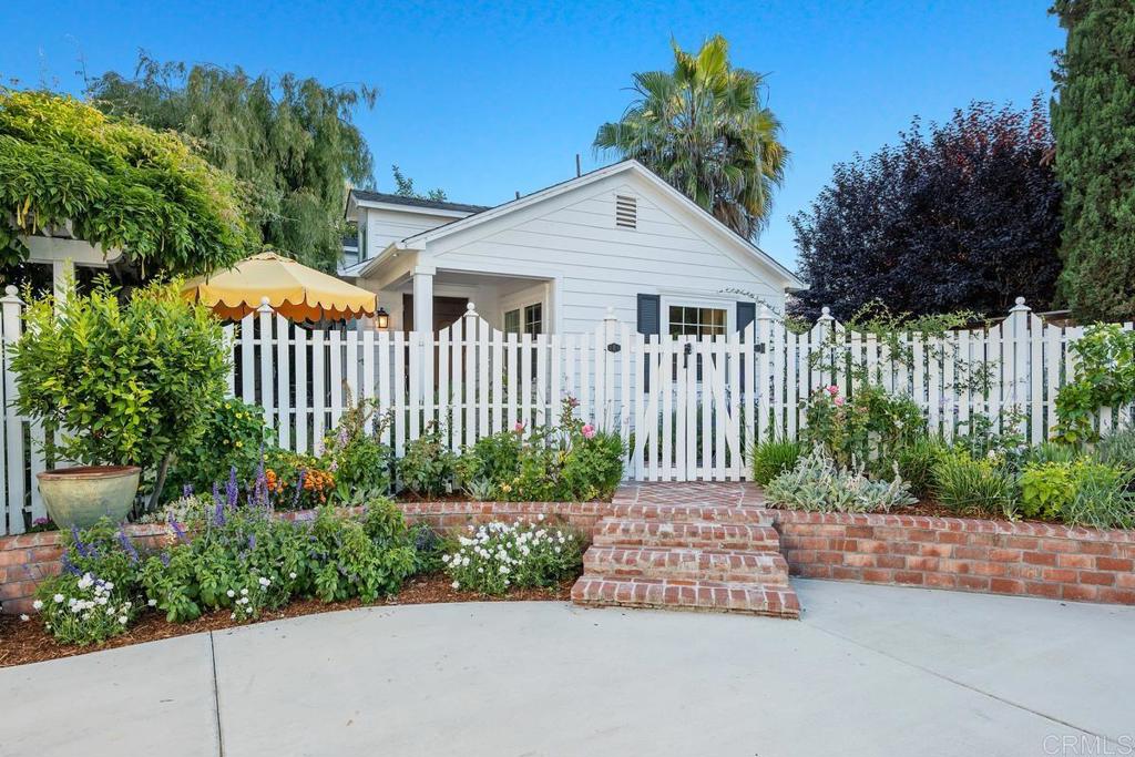 2539 Lone Jack Road Encinitas, CA 92024 - Photo 27 of 37 a front view of a house with a garden