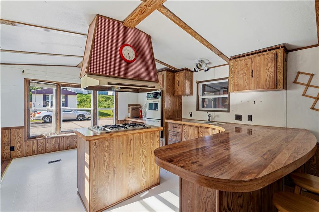 1300 Hidden Valley Road Bulger, PA 15019 - Photo 13 of 25 a dining table with chairs and cabinets