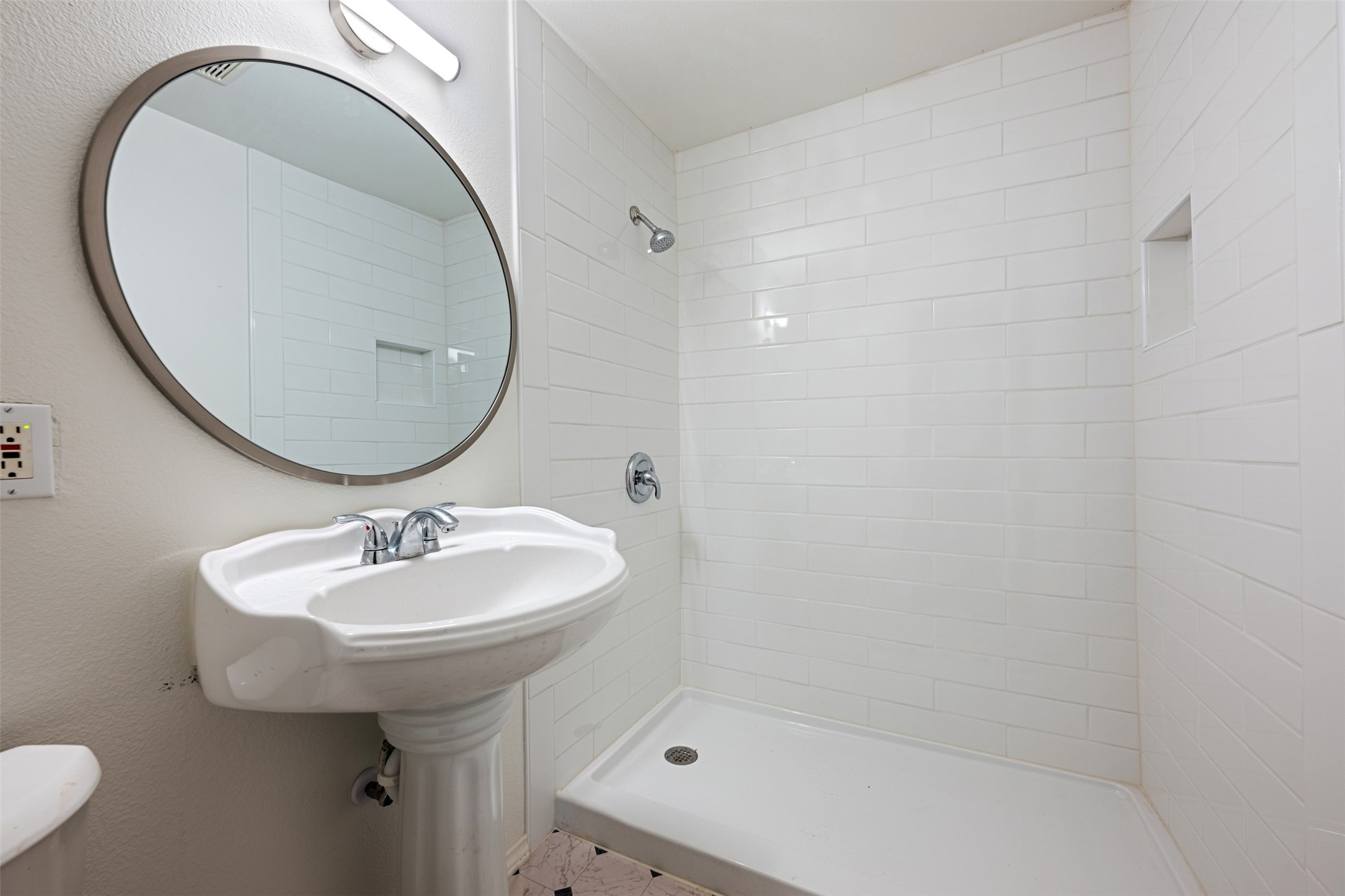 901 Valdez Street, Unit 13 Austin, TX 78741 - Photo 11 of 38 a bathroom with a sink a toilet and a mirror