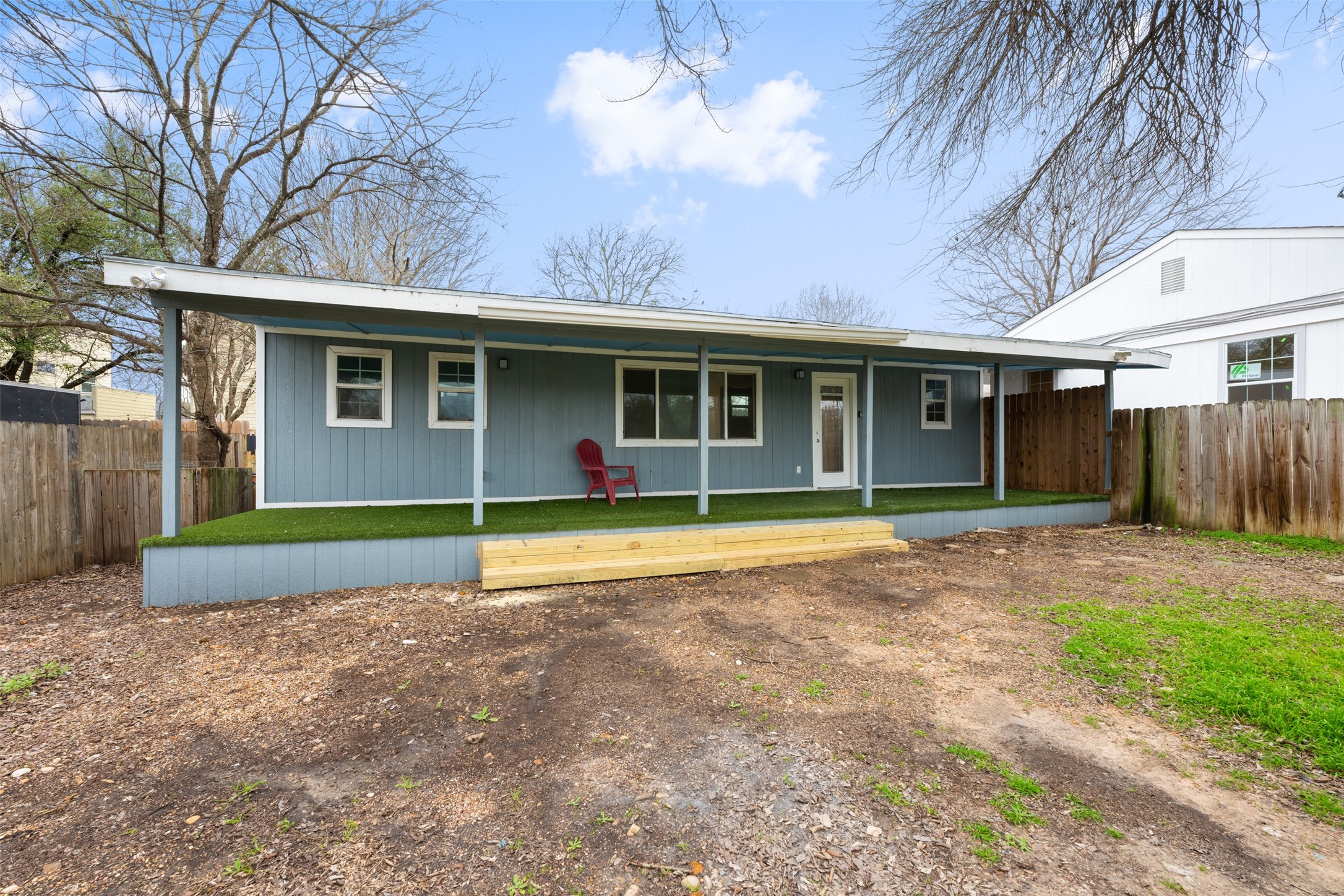901 Valdez Street, Unit 13 Austin, TX 78741 - Photo 14 of 38 a view of an house with backyard and a tree