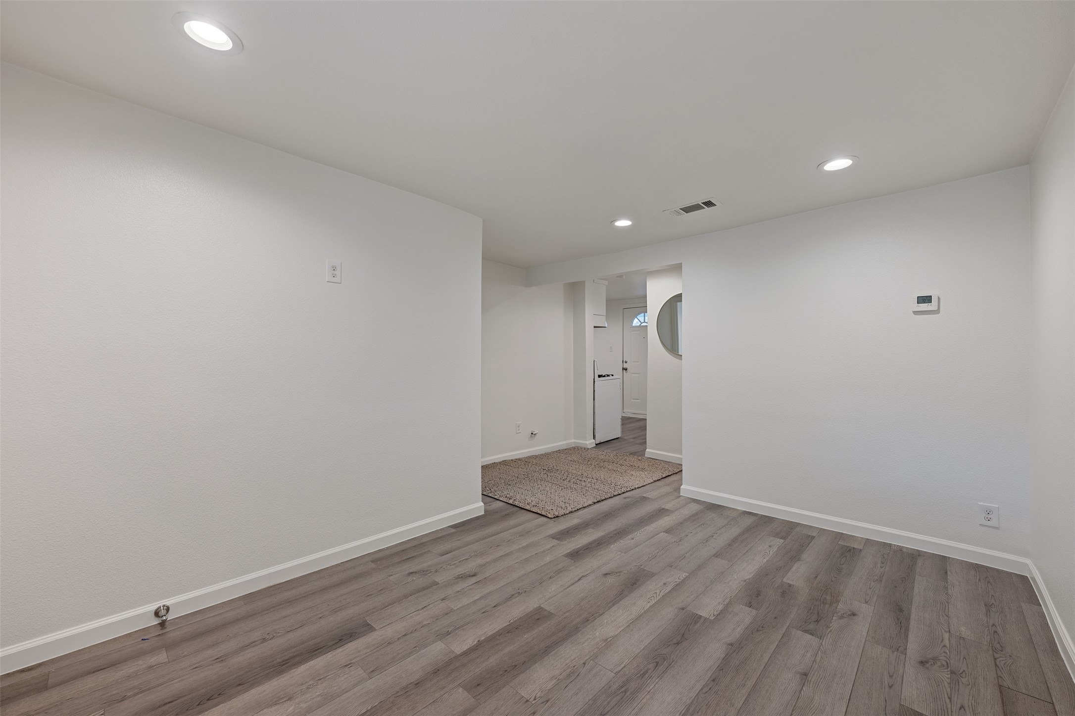901 Valdez Street, Unit 13 Austin, TX 78741 - Photo 31 of 38 a view of empty room with wooden floor